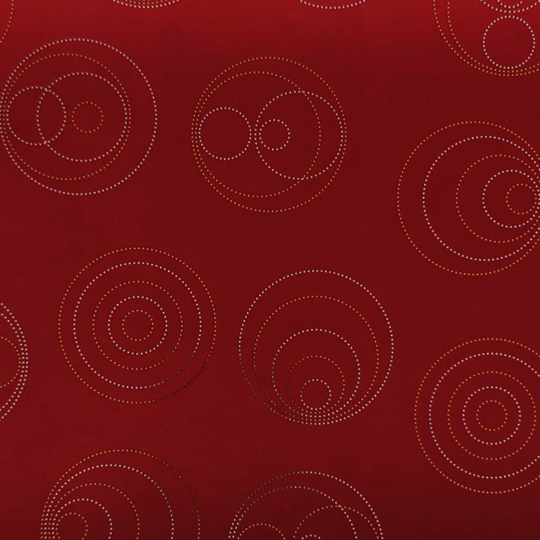 Gift wrapping paper gold and silver metallic shiny dots in a circle shape with a deep matte red background.
 